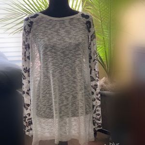 Sheer tunic style top with cheetah sleeves